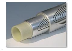 For a Direct Double Helix, a CNC guided mill or laser cuts insulation paths in a cylinder of conducting material (aluminum here). Conductor cross sections can then be varied by altering distance between cuts to generate needed fields in certain locations.  