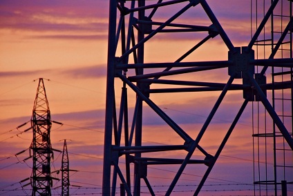 Transmission tower against a setting sun Transmission towers