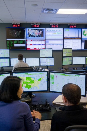 Two Iberdrola technicians monitor weather at its U.S. wind farms. Each turbine supplier provides its own control and HMI system. The major advantages of using PcVue as the main SCADA system is that it is not tied to any one PLC vendor so that it operates irrespectively of turbine type. 