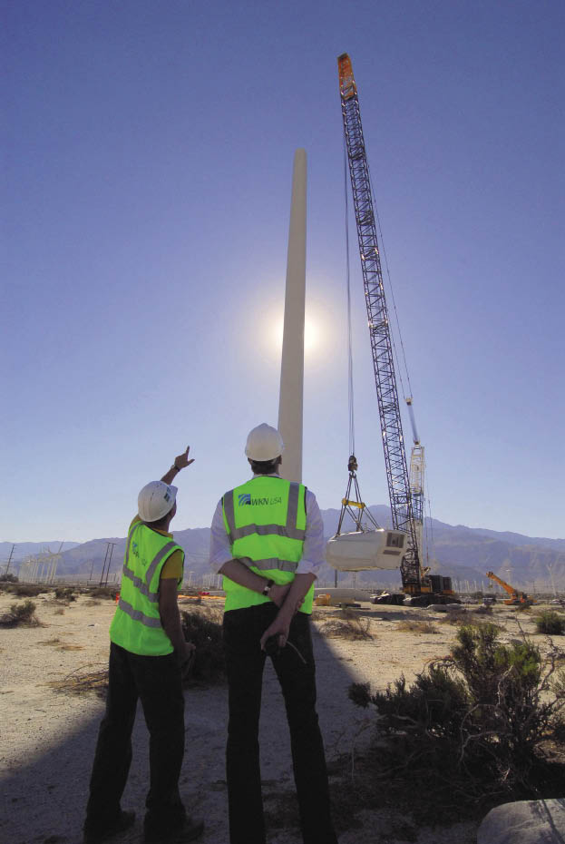 Two men pointing to progress. 