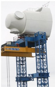 When GE acquired Scanwind in 2009, it also acquired clever tower and nacelle-lifting technique tailored to placing large turbines in complex terrain. The design erects two lattice towers on either side of a site to lift the tower and nacelle into place. The company says the lifting towers work in winds up to 15 m/s, winds frequent on coasts. Since the purchase, GE has been mum on how it will use the equipment.