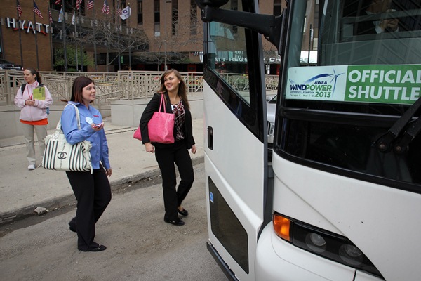Windpower Engineering and Development social media coordinator Heather Centorbi and “summer sales professional” Alyson Kado hop on the shuttle to AWEA Windpower 2013 conference and exhibition in Chicago.