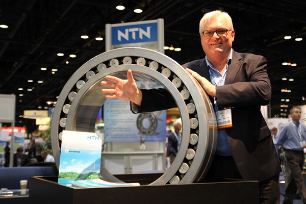 Curt Busch waves to the camera at the NTN Bearing Corporation booth. The company is an OEM supplier to multiple turbine and turbine component manufacturers.