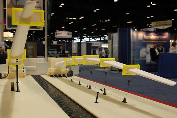 A model at the MTS booth demonstrates two types of wind-turbine blade testing: static and fatigue (left). Test engineers rely on the company for testing technologies and expertise required to accelerate and improve research, design, development, and manufacturing.