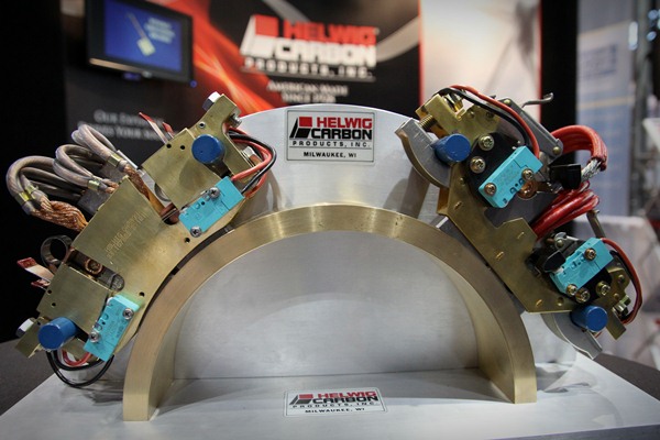 Helwig Carbon Products showed two electric brush holders at its booth. The right one is a standard holder used by OEMs. Company representatives said it was unnecessarily complex, while the Helwig holder (on the left) will last twice as long.