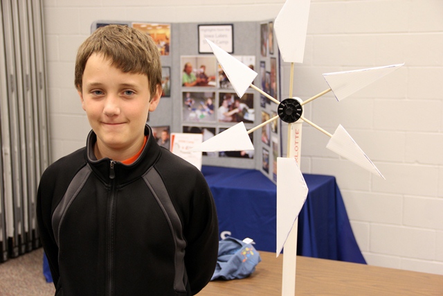KidWind came to Iowa Lakes' campus the same time as WindTech. The KidWind Project is a team of teachers, engineers, and scientists committed to innovative energy education. Here, 12-year-old David Holt stands by his test turbine. He says windpower is a "good thing."