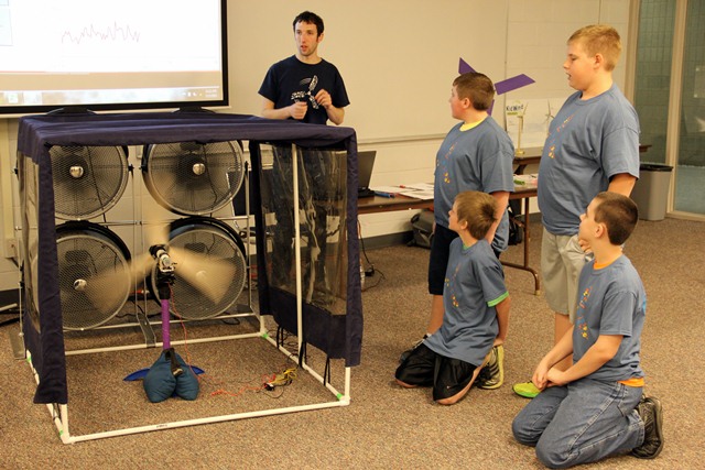 Rob Yedlin of KidWind takes measurements of a group's wind turbine. Groups were awarded based on power output and other criteria.