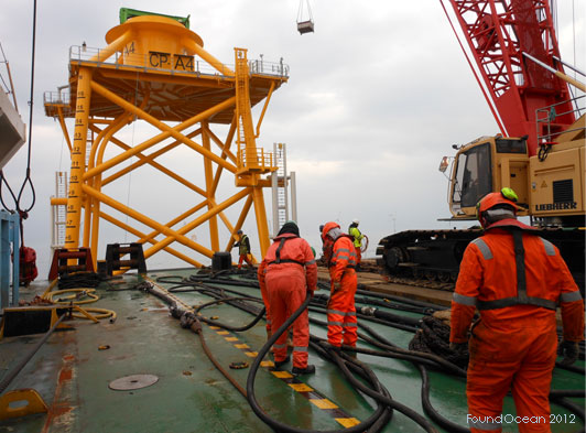 More than 3,800 tons of cement were used constructing phases two and three of the 326-MW Thornton Bank Offshore Wind Farm. The 49 four-legged OWEC Quattropod® foundations were designed by OWEC Tower and were secured to the seabed by grouting the annuli between the stab-in legs and pre-driven piles. Each leg was equipped with a primary and secondary grout line terminating on the mid-section deck for ease of access, and connection of the grout hose. A tertiary grout line was provided as a backup connection in the event that contingency grouting was necessary. This was fitted with a FoundOcean ROV male subsea grout connector terminating above the pile stopper.
