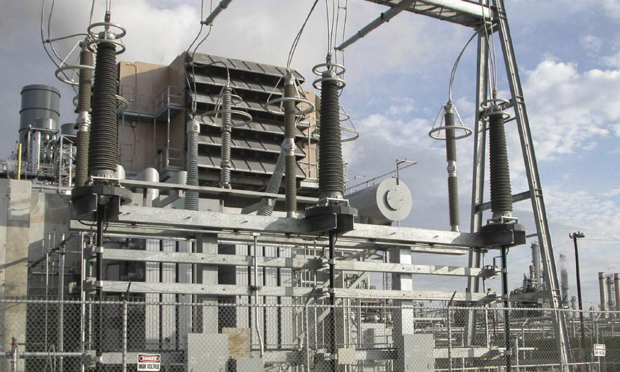 The slipover CT (arrow) installs over the high-voltage bushings of power transformers, circuit breakers, or cable terminations.