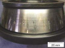 White Etch Cracks and White Surface Flaking appear on the inner ring of a tapered roller bearing. Evidence suggests that both were initiated by WEA microstructural alterations in the steel subsurface. Courtesy A. Greco et al 1