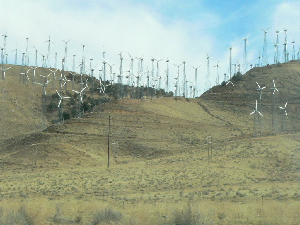 Parts of California look like a turbine museum with many small turbines, less than 500 kW on lattice towers. If they are still working at 20 years, they might keep working or retire to make room for a few utility-scale turbines with a greater total output.  Photo: Roy Dvorak