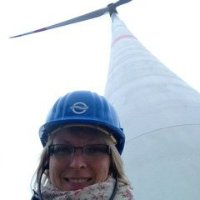That’s me, smiling underneath a 3-MW, 200-meter Nordex turbine at Hamburg Wasser in Germany last year. The wastewater treatment plant already harnessed the biogas produced at its facility, but also added wind power to the mix—generating 120% of its energy needs. 