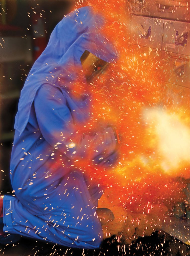 The foresightful worker is attired in personal protective equipment to safeguard against the arc-flash.