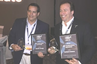 Anthony Conti, of NextEra Resources, and Edward Wagner, of Sentient Science, accepted awards for industry excellence at the Wind Energy Update Dallas O&M Show on April 11.