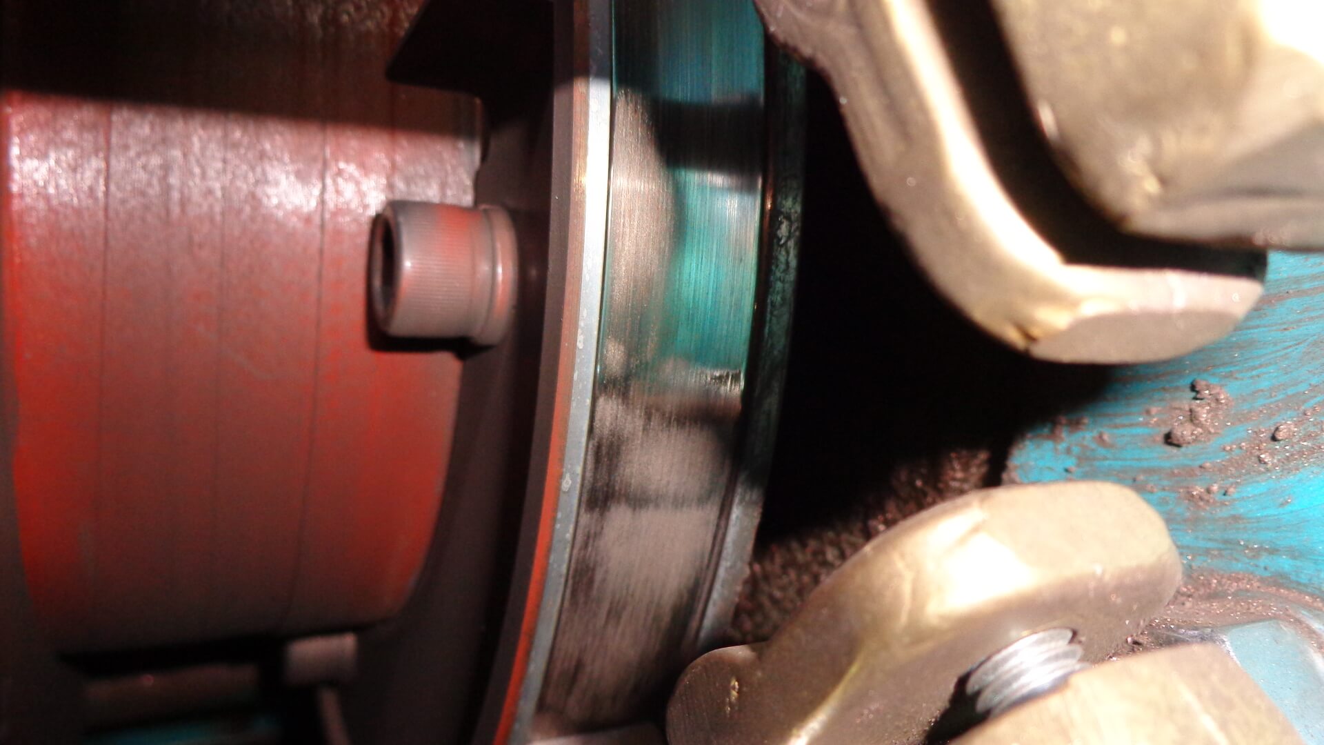 An example of a damaged ground ring with grooving caused by arcing between the ground ring and the brush face.